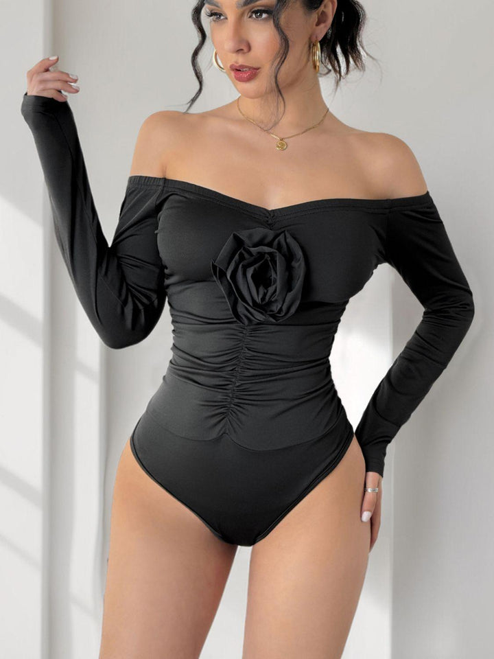 Perfee Ruched Flower Off-Shoulder Long Sleeve Bodysuit - JOWLILI