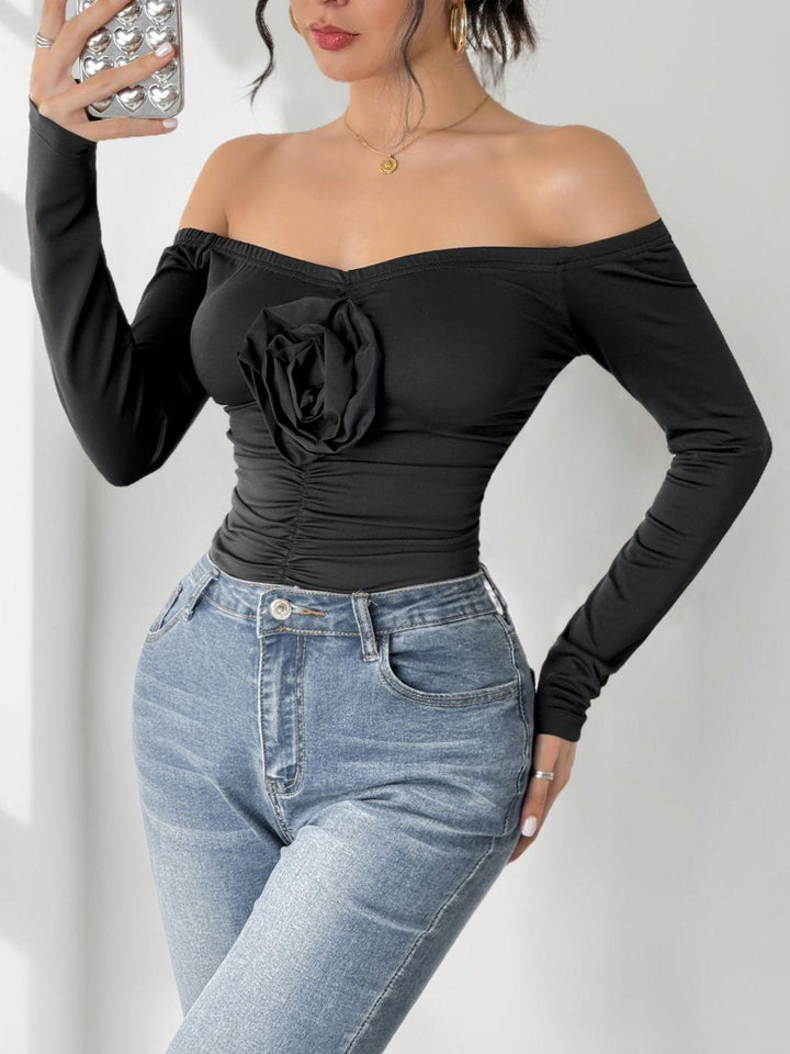 Perfee Ruched Flower Off-Shoulder Long Sleeve Bodysuit - JOWLILI