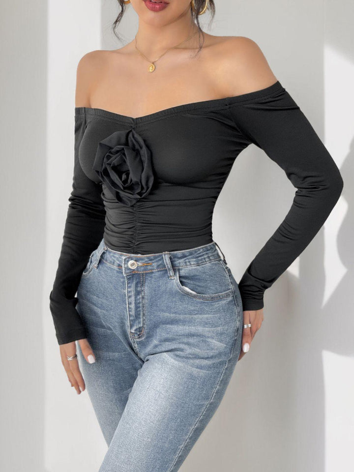Perfee Ruched Flower Off-Shoulder Long Sleeve Bodysuit - JOWLILI